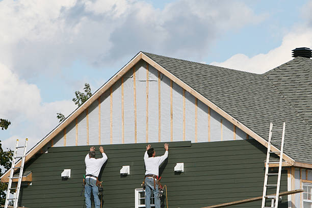 Professional Siding Replacement technician working in Canton, MA